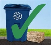 Image of Recycling Bin with cardboard next to it
