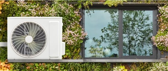 Image - Heat Pump HVAC Unit next to a window